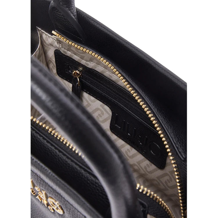 Borsa a mano nera con charm rimovibile