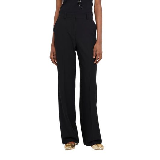 Pantalone Donna con tasche a filetto e logo metallico