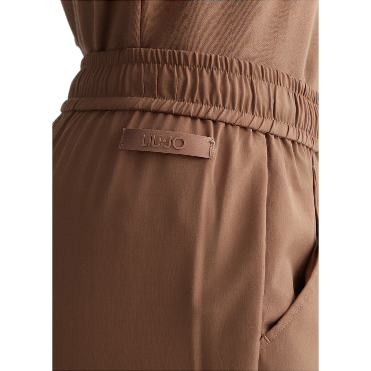 Pantaloni Donna cropped in misto bambù stretch marrone dettaglio patch logata