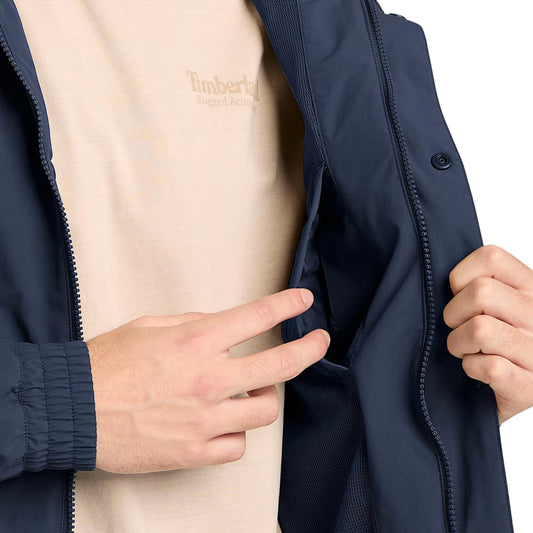 Bomber impermeabile in blu scuro con cappuccio ripiegabile