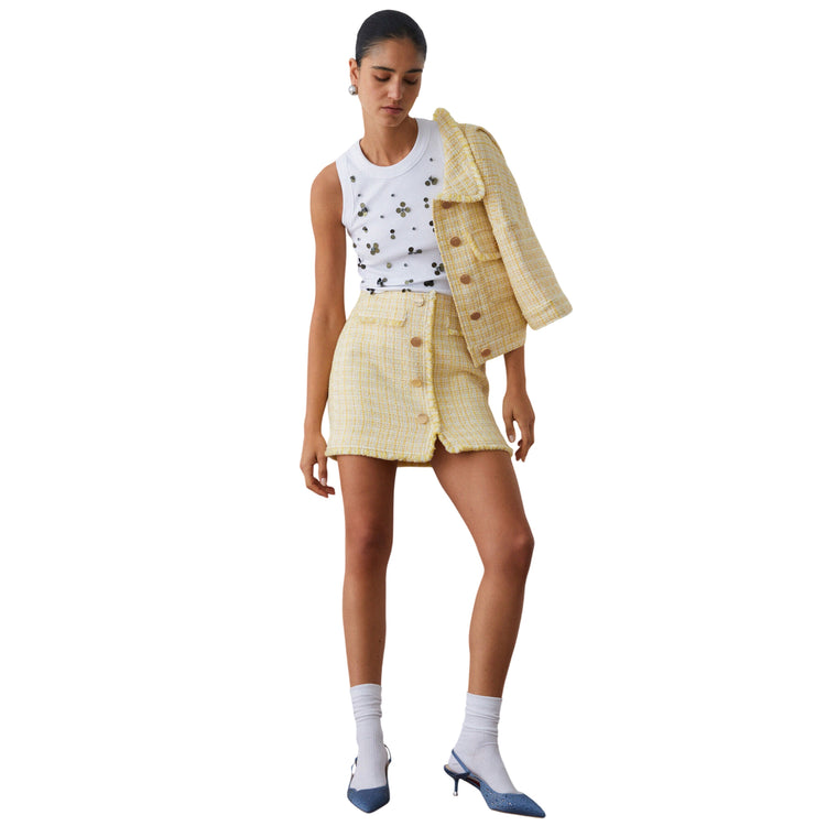 Top bianco con applicazioni dorate