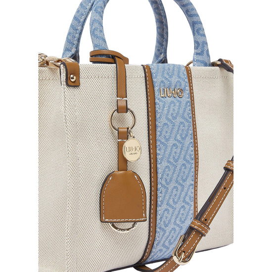 Borsa a mano beige e denim con tracolla 