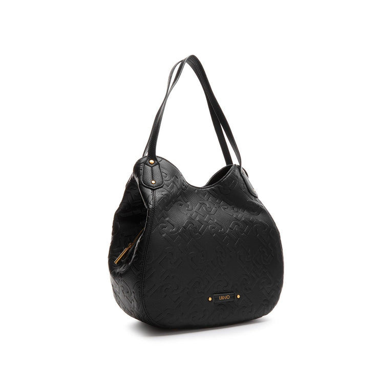 Women's bag with leather inserts and all-over logo