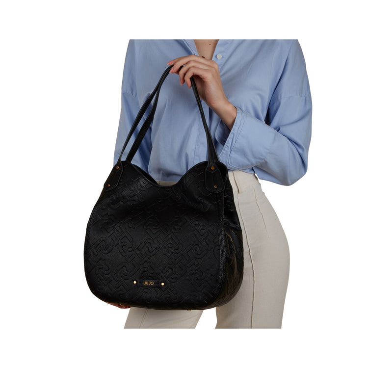 Women's bag with leather inserts and all-over logo