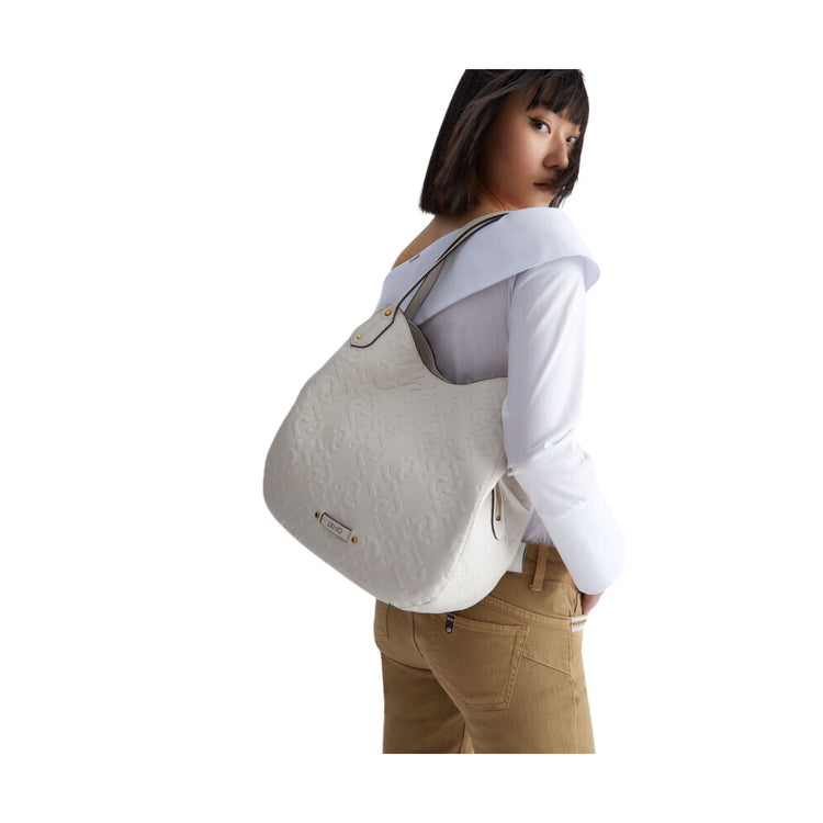 Women's bag with leather inserts and all-over logo