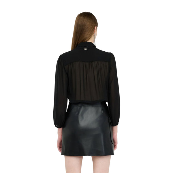 Abito Donna con gonna tessuto spalmato Nero modella retro