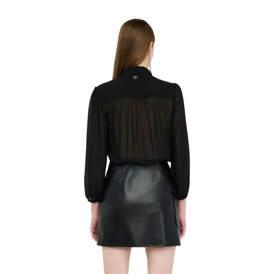 Abito Donna con gonna tessuto spalmato Nero modella retro