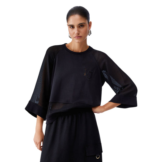 Felpa nera con maniche ampie e trasparenti