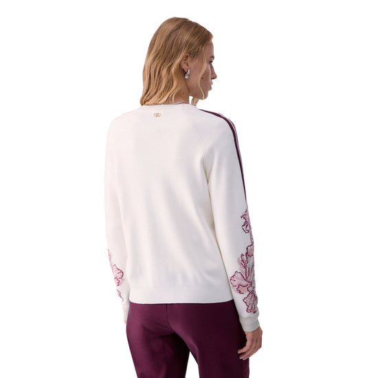 Cardigan Donna con lavorazione jacquard floreale, modella retro