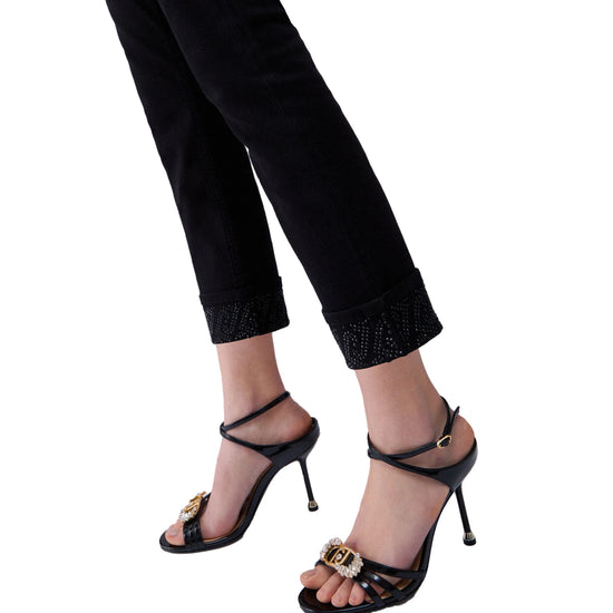 Pantaloni skinny Donna con risvolto e strass Nero dettaglio fondo