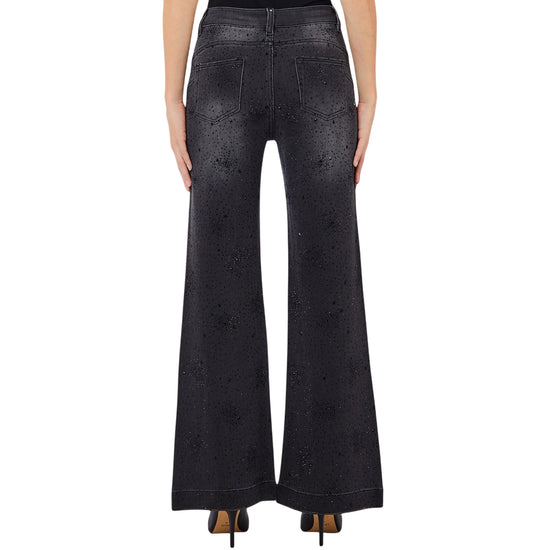 Jeans Donna a zampa, in denim nero, con strass neri, modella retro