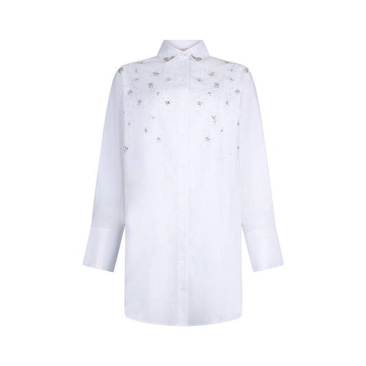 Abito bianco impreziosito con ricami gioiello