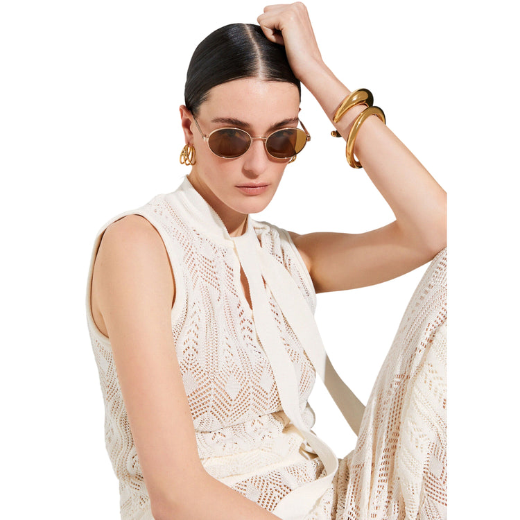 Top panna in maglia con fiocco