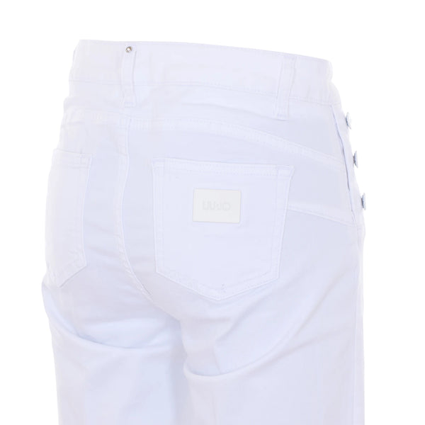 Jeans skinny bianchi con bottoni laterali