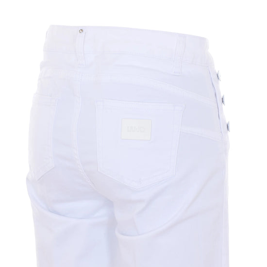 Jeans skinny bianchi con bottoni laterali