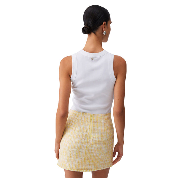 Top bianco con applicazioni dorate