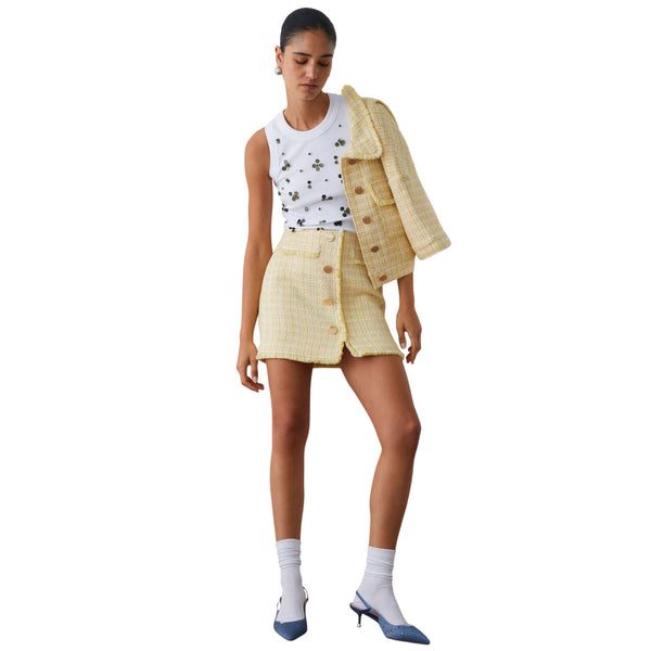 Top bianco con applicazioni dorate