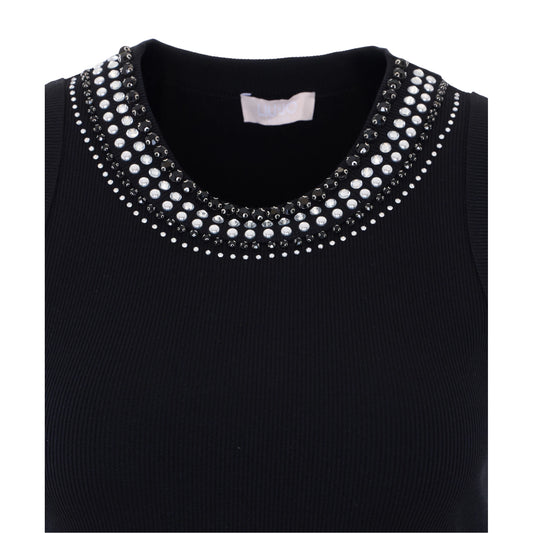 Canottiera nera con borchie bianche e nere