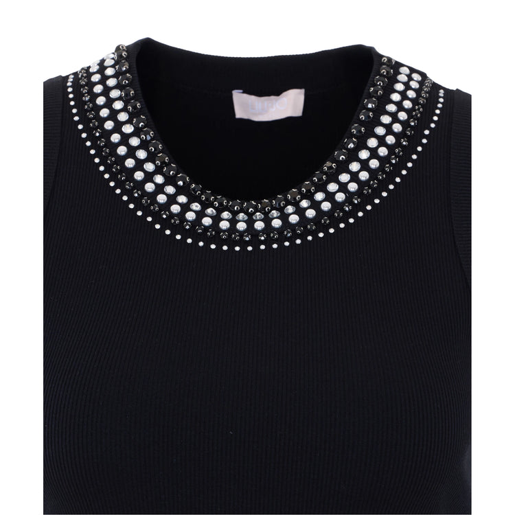 Canottiera nera con borchie bianche e nere