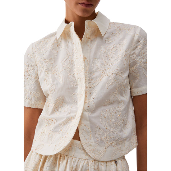 Camicia a maniche corte di cotone con ricami in bianco