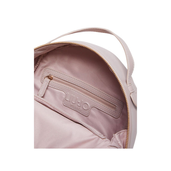 Dettaglio ravvicinato chiusura con zip e tasca interna con zip colore Rosa